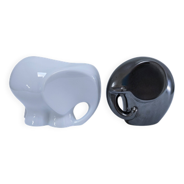 Two iridescent black and white ceramic elephants design