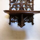 Carved wooden wall shelf