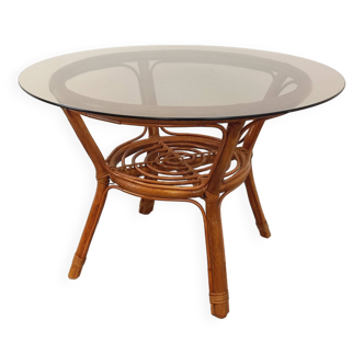 Vintage round smoked glass and rattan coffee table from the 70s