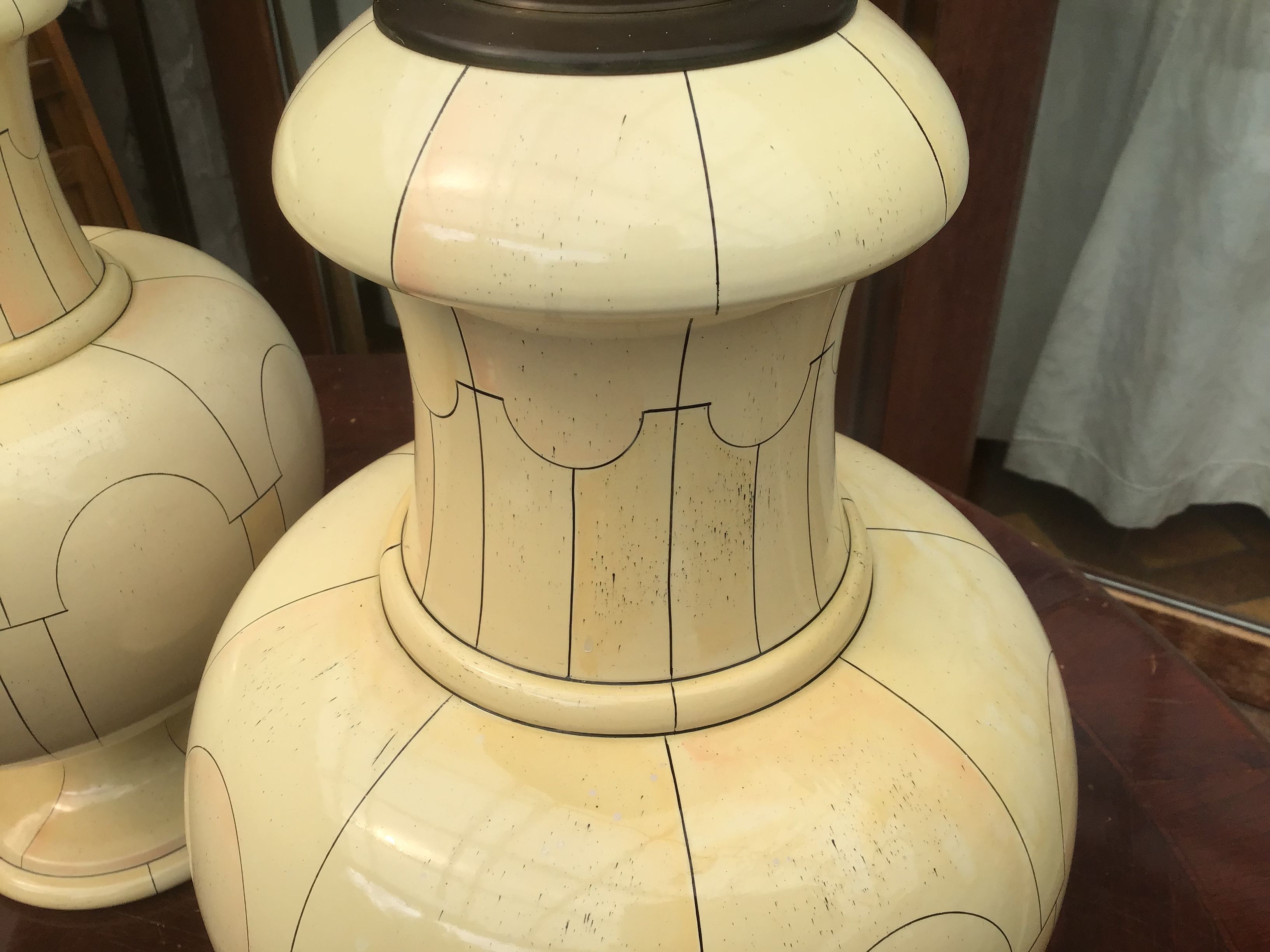 Jean Roger in Paris. Pair of ceramic baluster lamps decorated with arches and ivory imitation