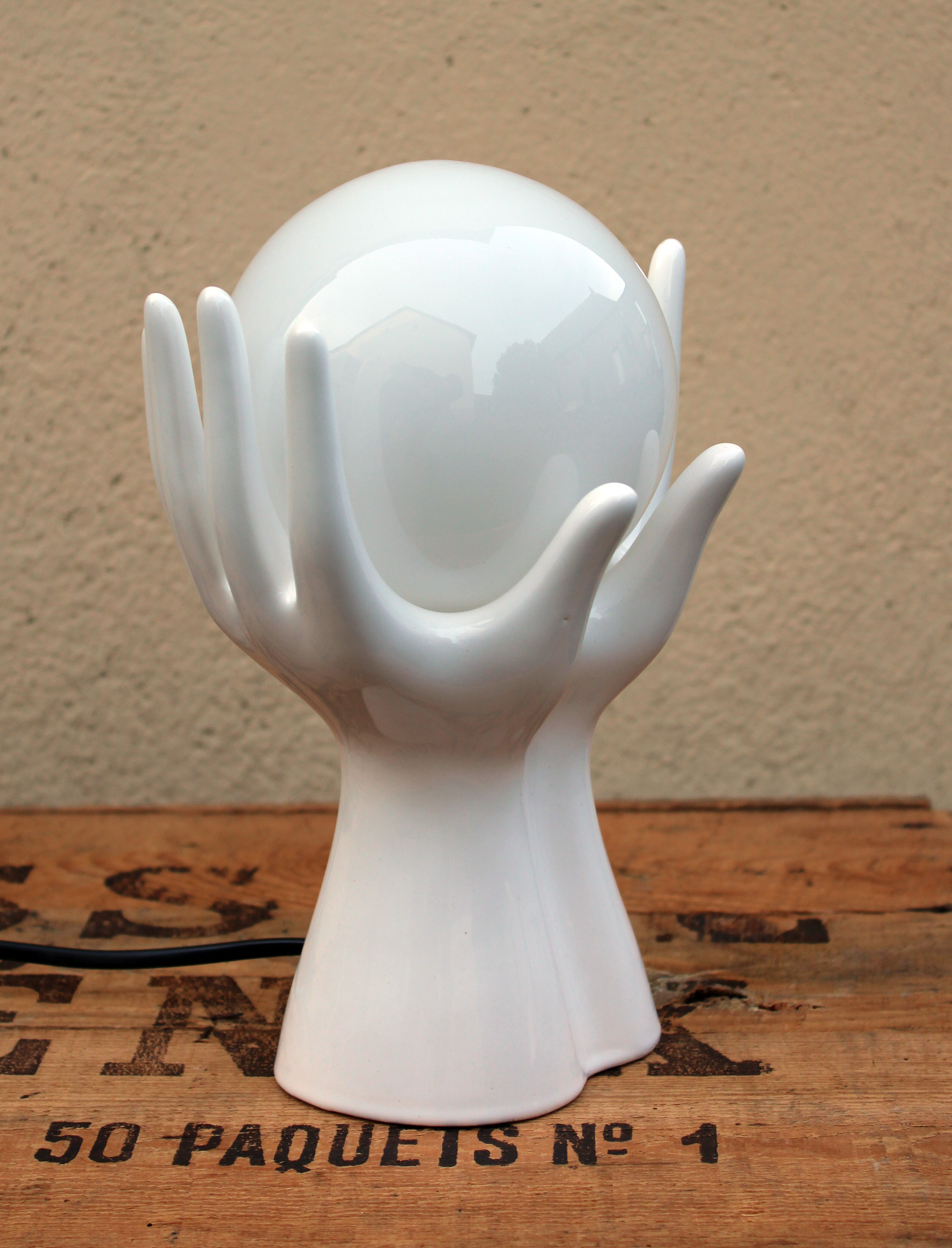 Hand-shaped lamp and opaline globe