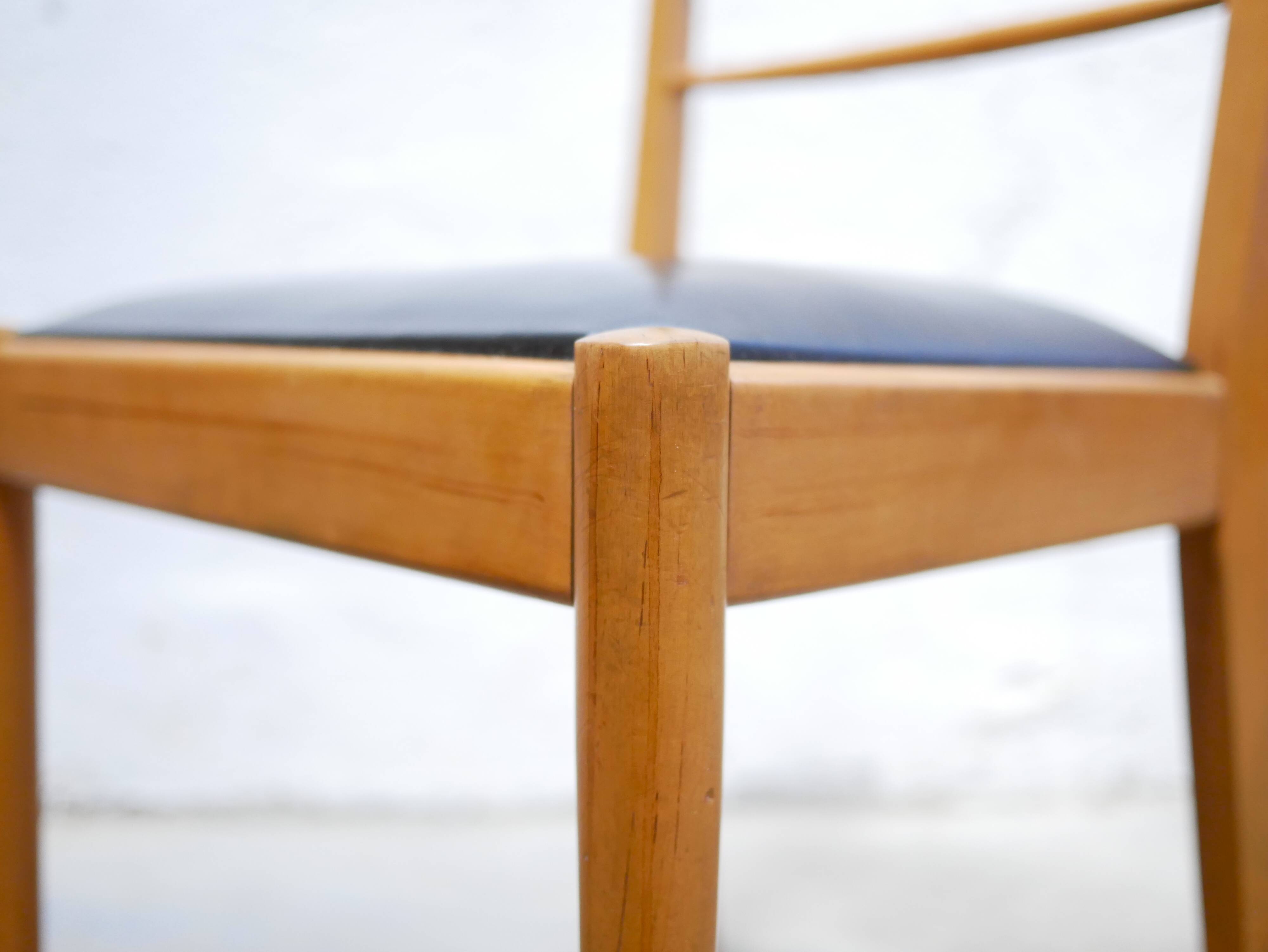 Series of 4 vintage chairs in wood and skaï