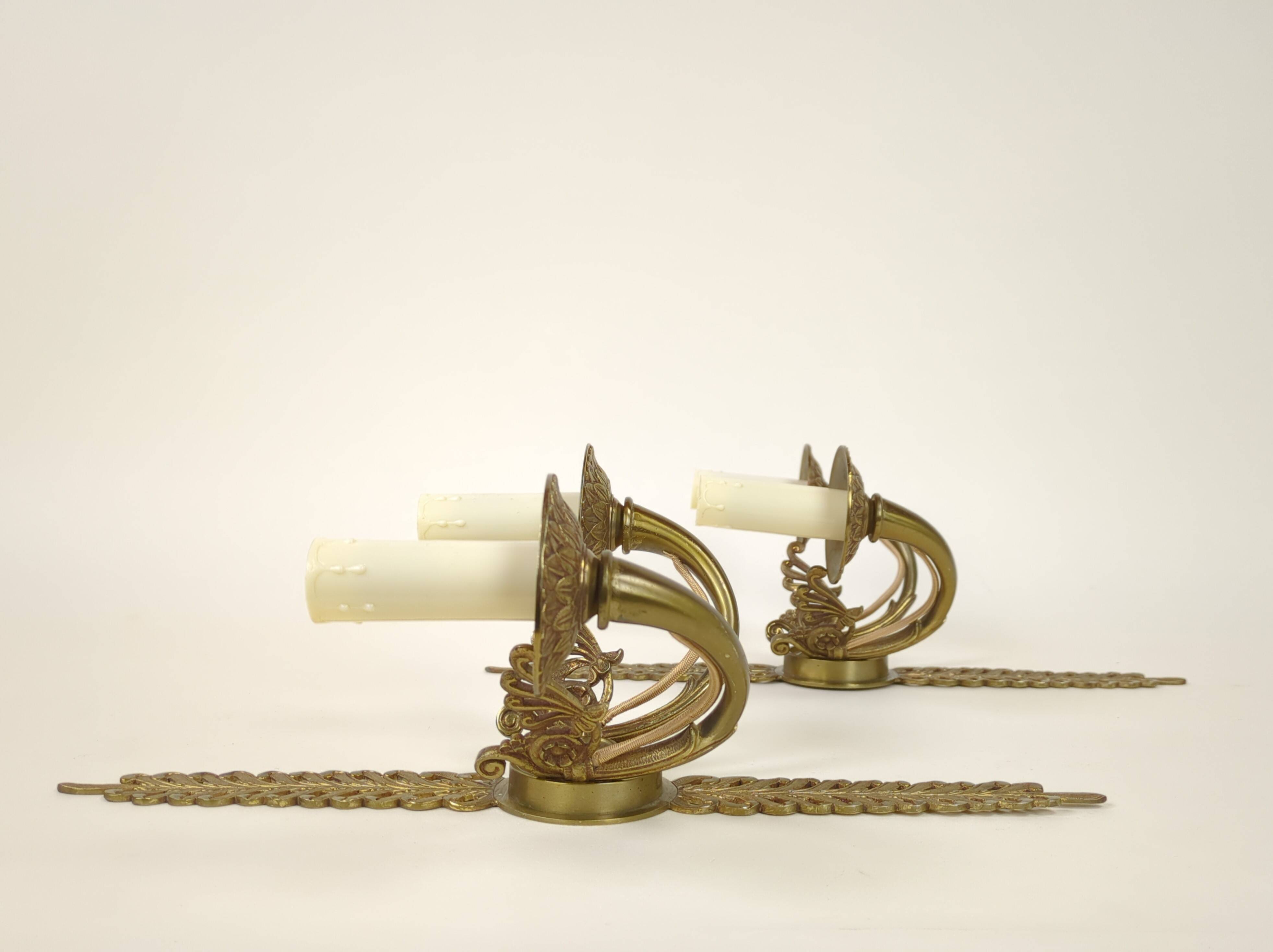 Pair of two-armed Empire wall sconces in gilded bronze