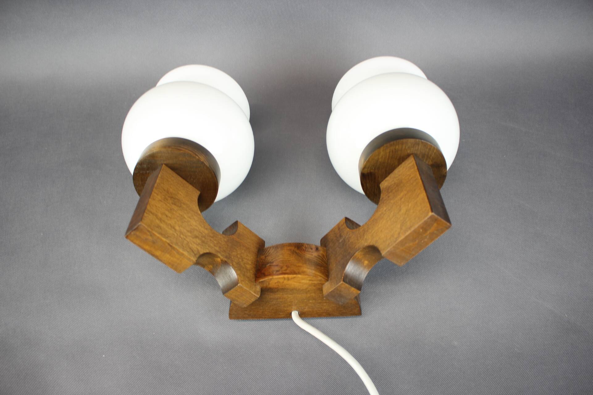 Czechoslovak wall lamp from the 1960s with Valasske Mezirici glass and a wooden base.