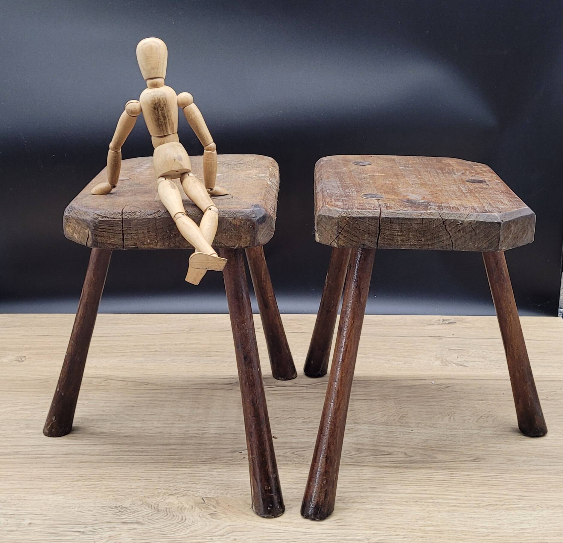 Pair of solid octagon cowhide tripod stools
