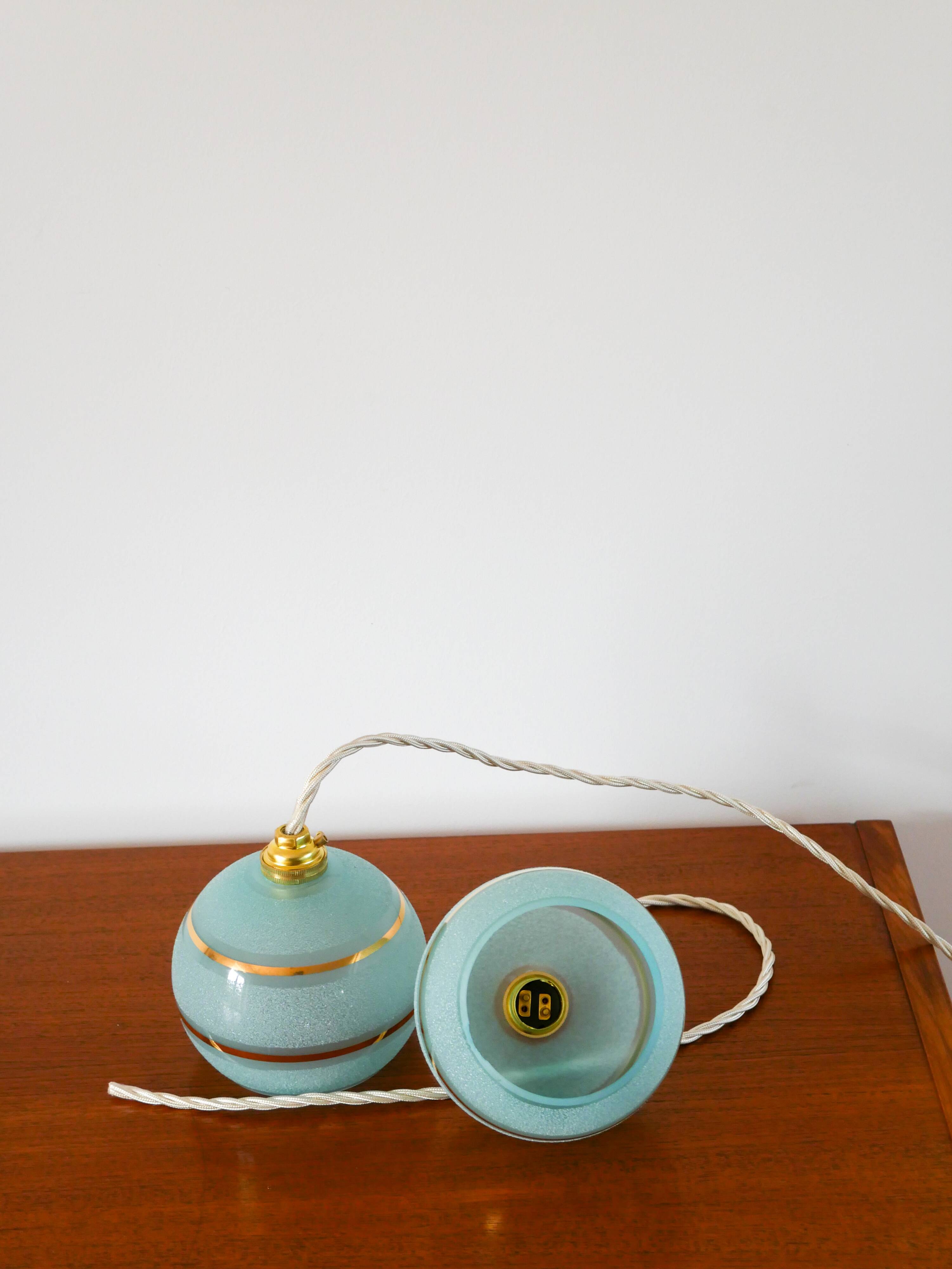 pair of blue and gold granite ball pendants 1950