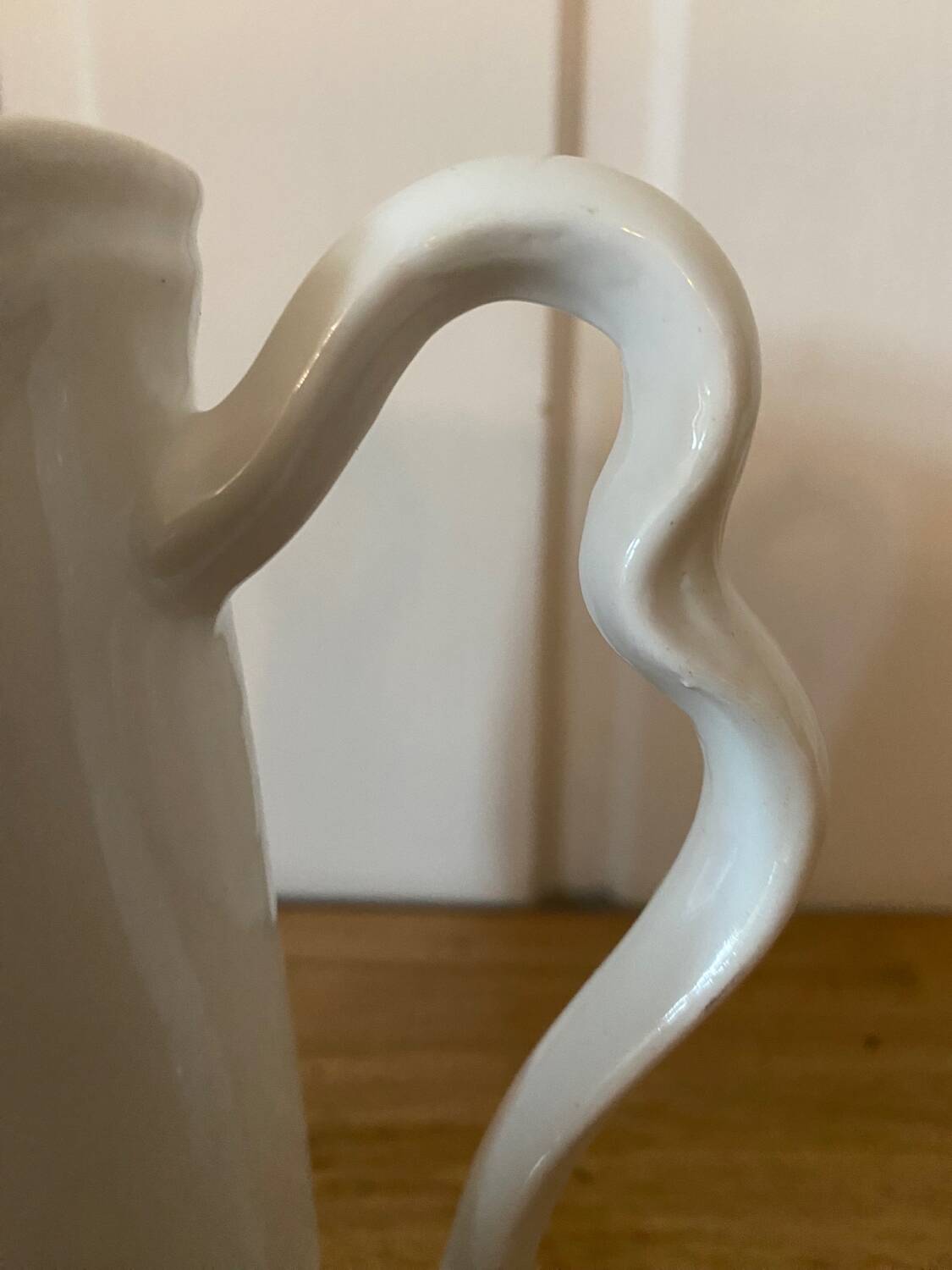 Old ceramic pitcher decorated with flowers