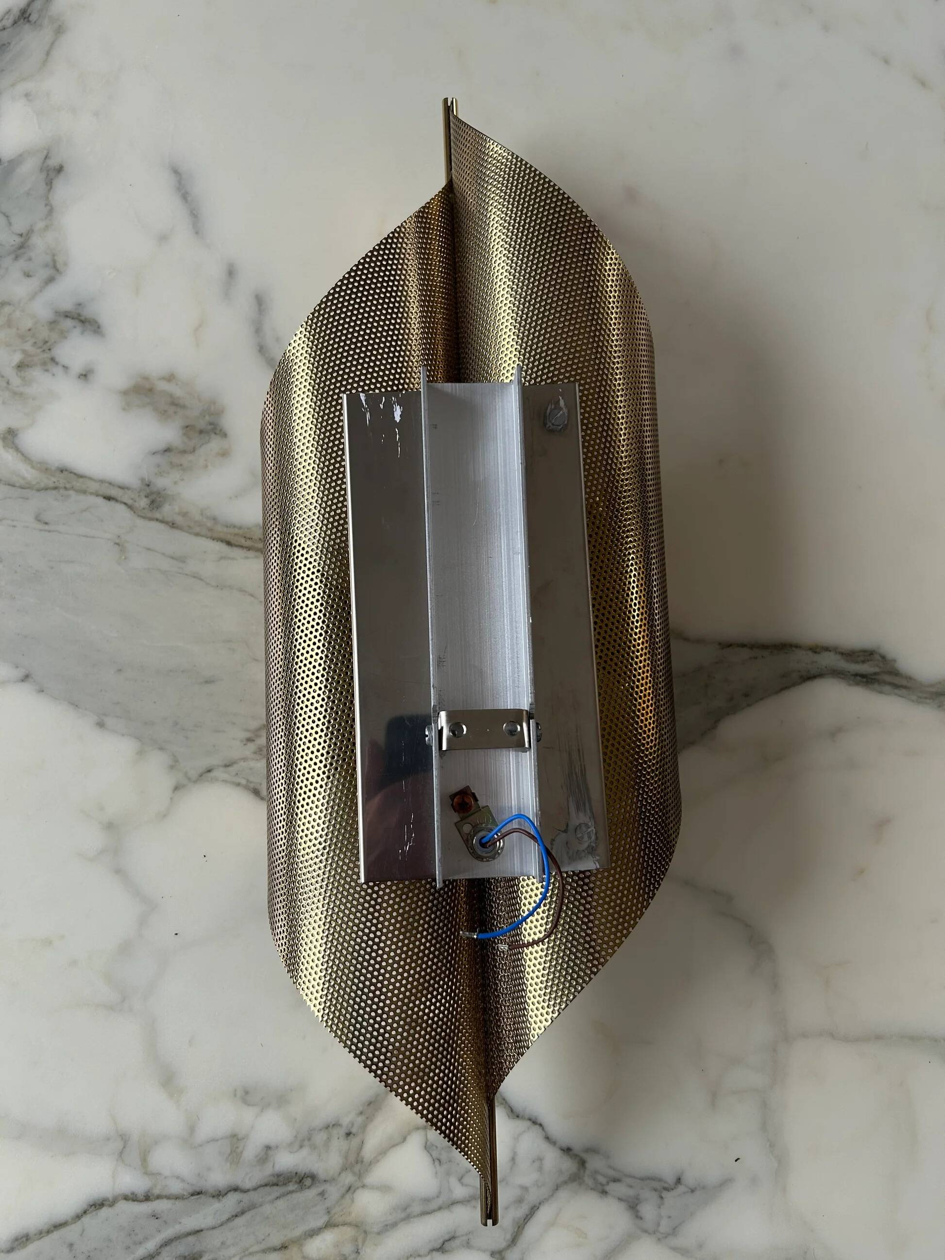 Pair of perforated brass wall lights by Christoph Palme, Germany, 1980s.