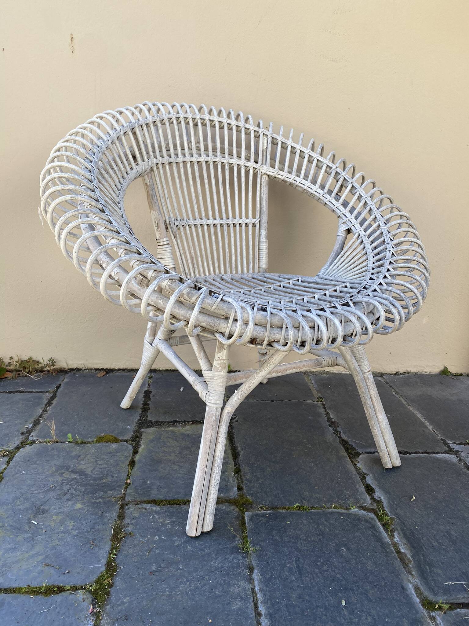 Vintage white rattan armchair