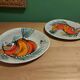 2 vintage ceramic plates with fish decoration