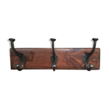 Metal patère on wood