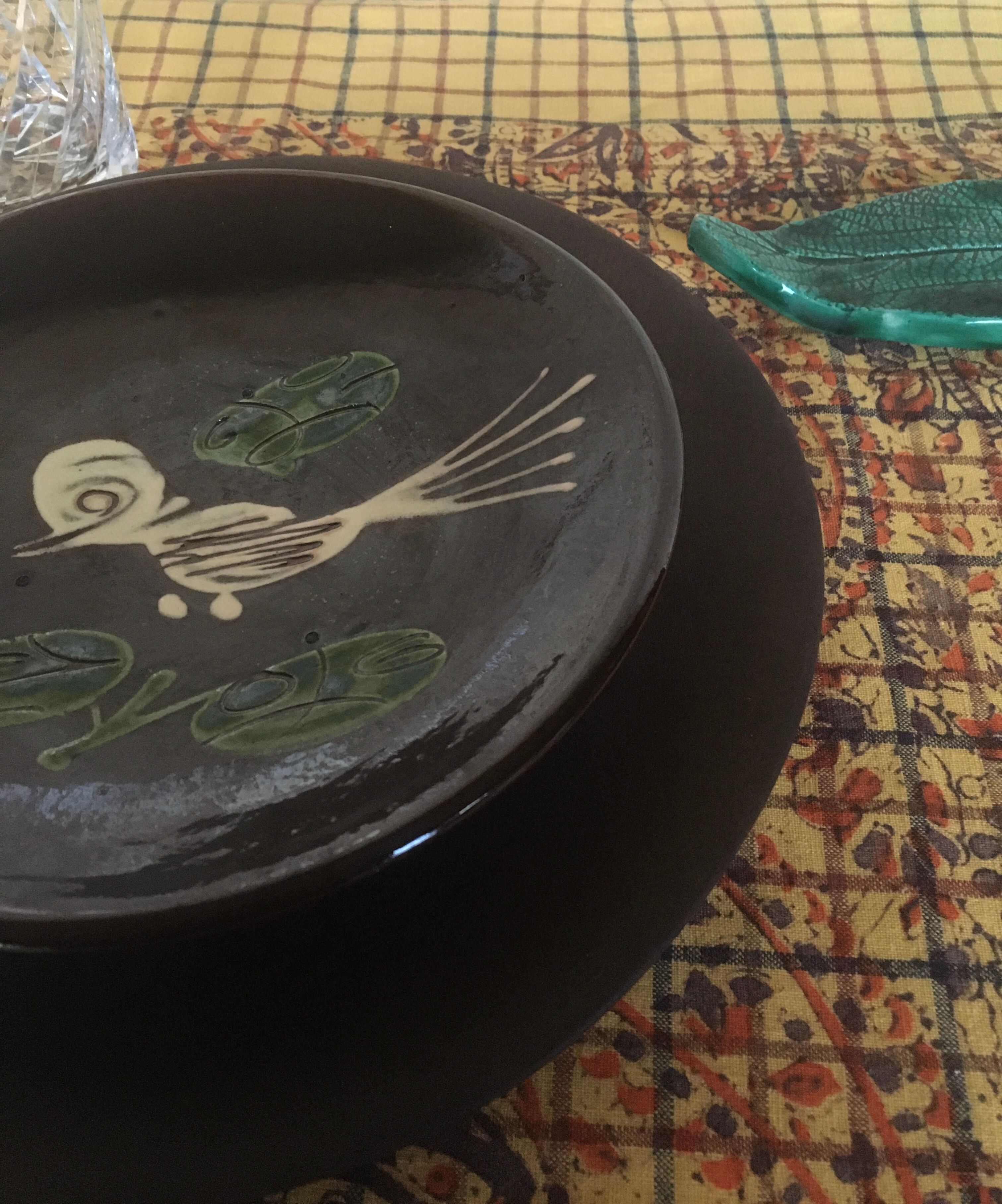 Four decorated ceramic plates