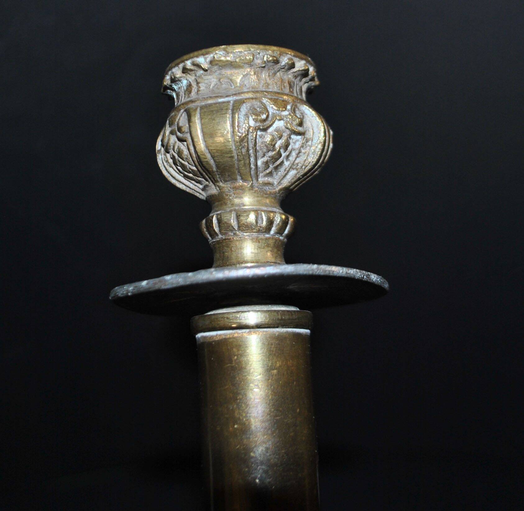 Lot of 2 antique brass and gilded bronze candle holders with acanthus decoration.
