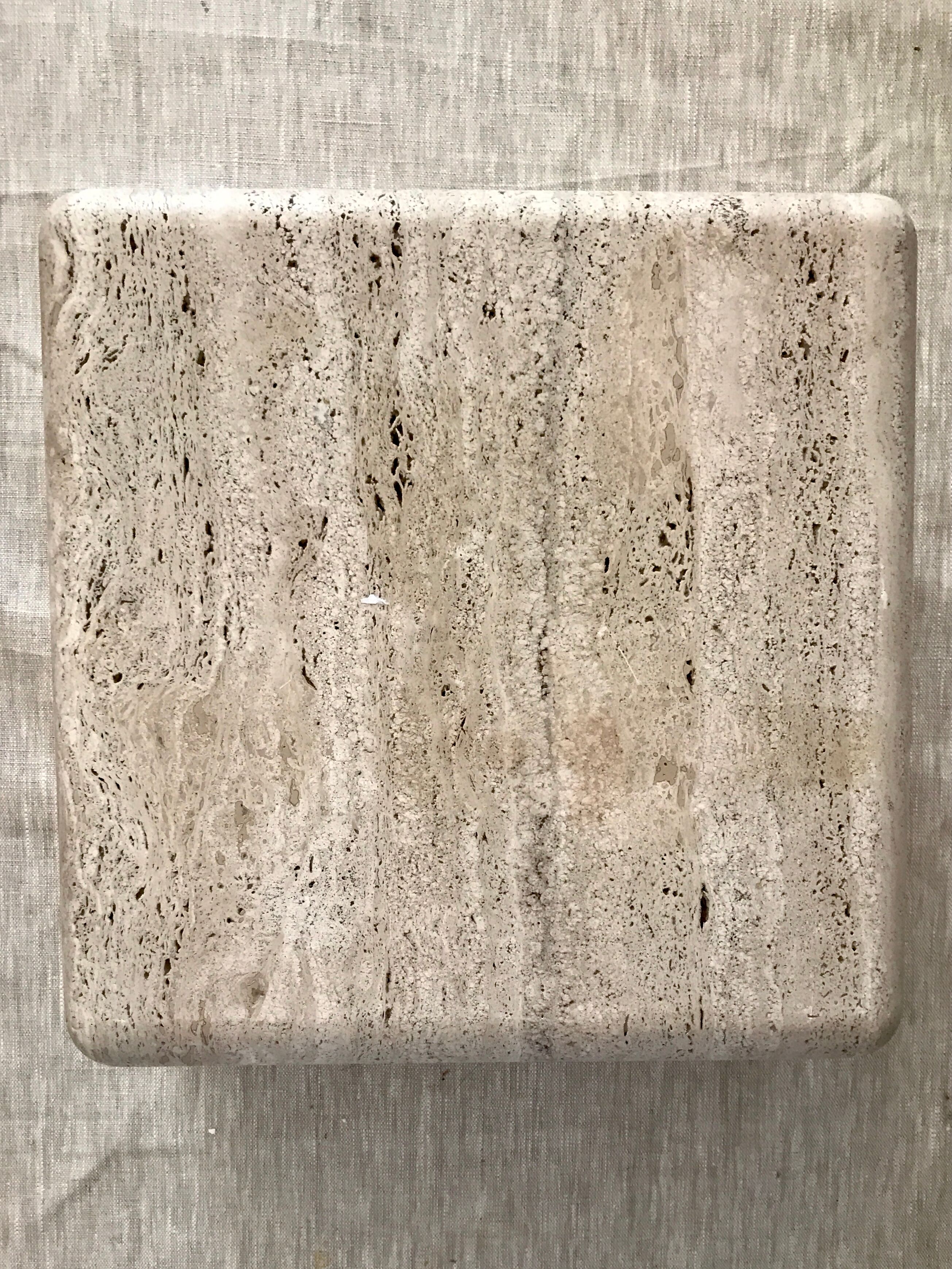 Sculptural travertine coffee table