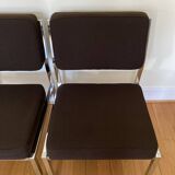 Pair of brown low chairs with chrome base