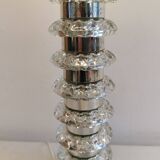 Table lamp made of transparent crystal glass and silver colored spacers.