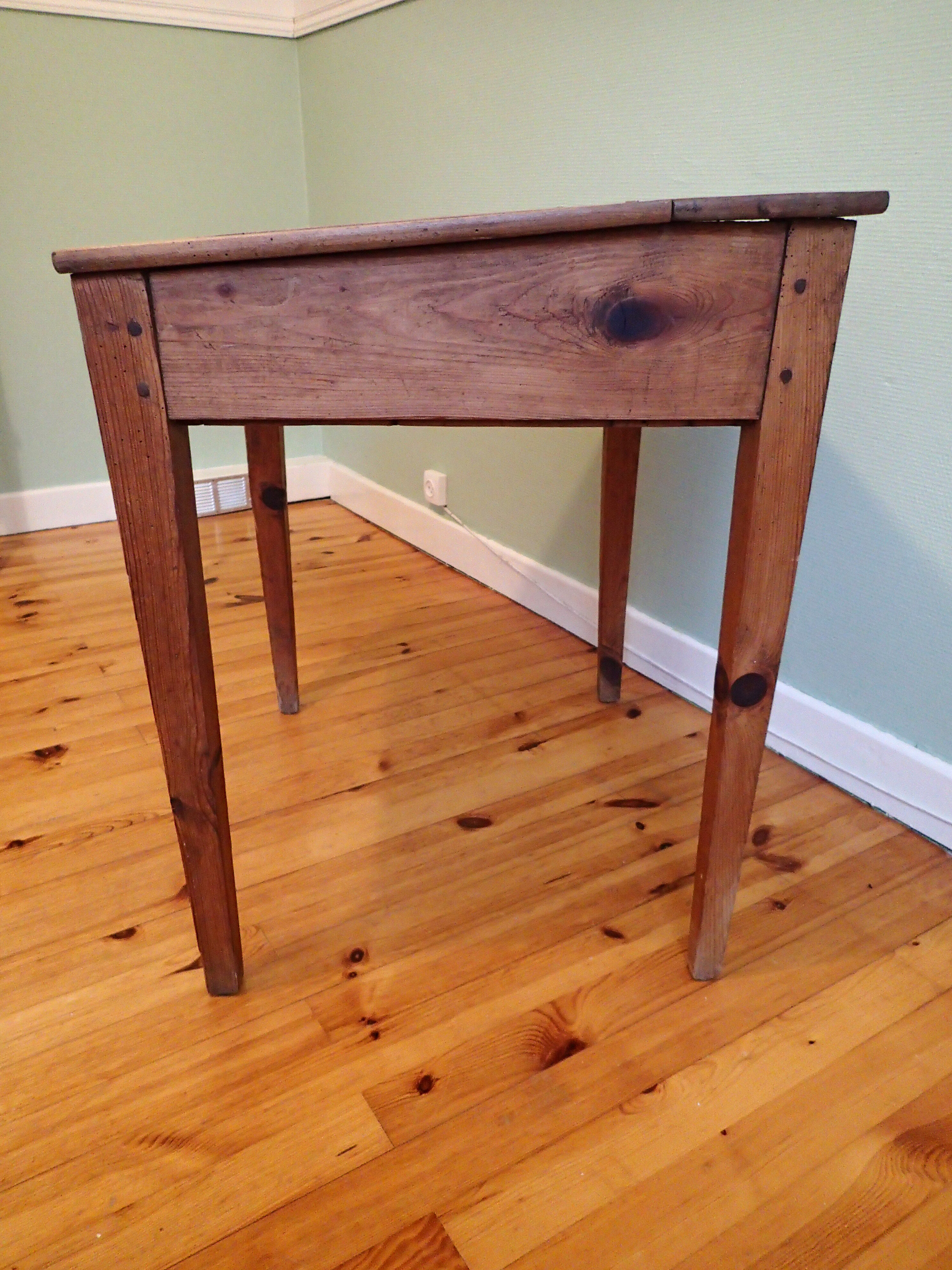 With knocking down old wooden school desk