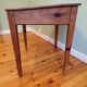 With knocking down old wooden school desk