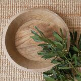 Raw wooden dish carved in the mass ethnic African art handmade artisanal manufacturing