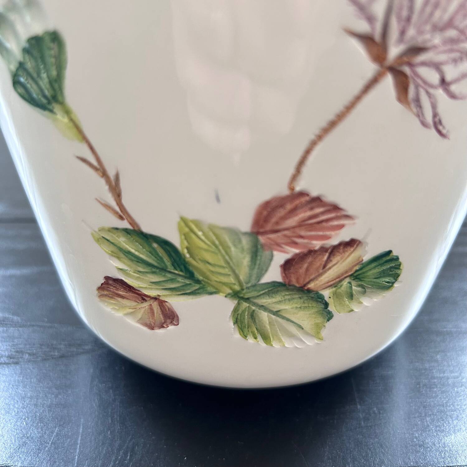 Flower pot with floral decoration in slip