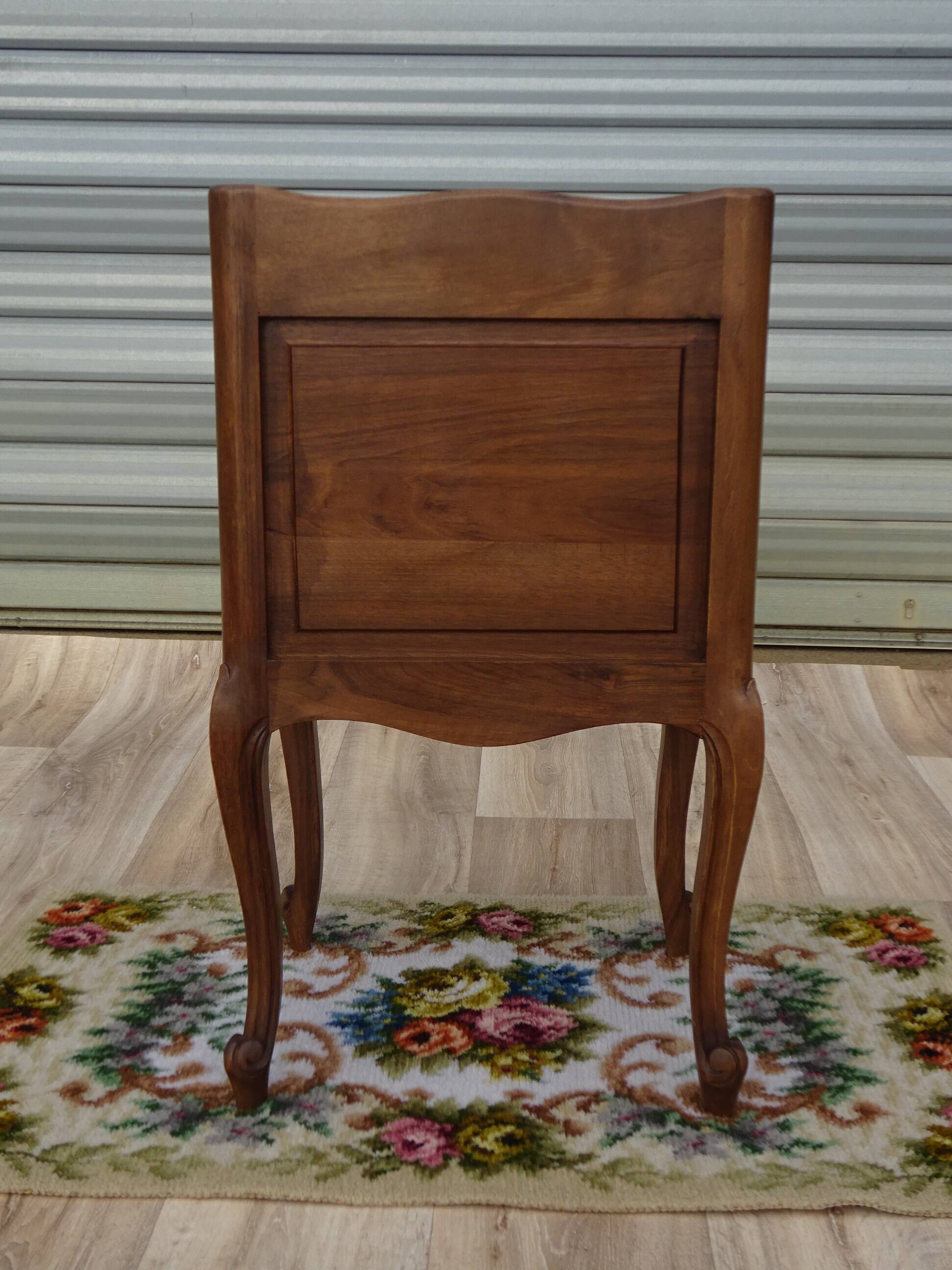 Louis XV bedside table in walnut, 3 drawers, raised edges on the tops.