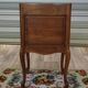 Louis XV bedside table in walnut, 3 drawers, raised edges on the tops.