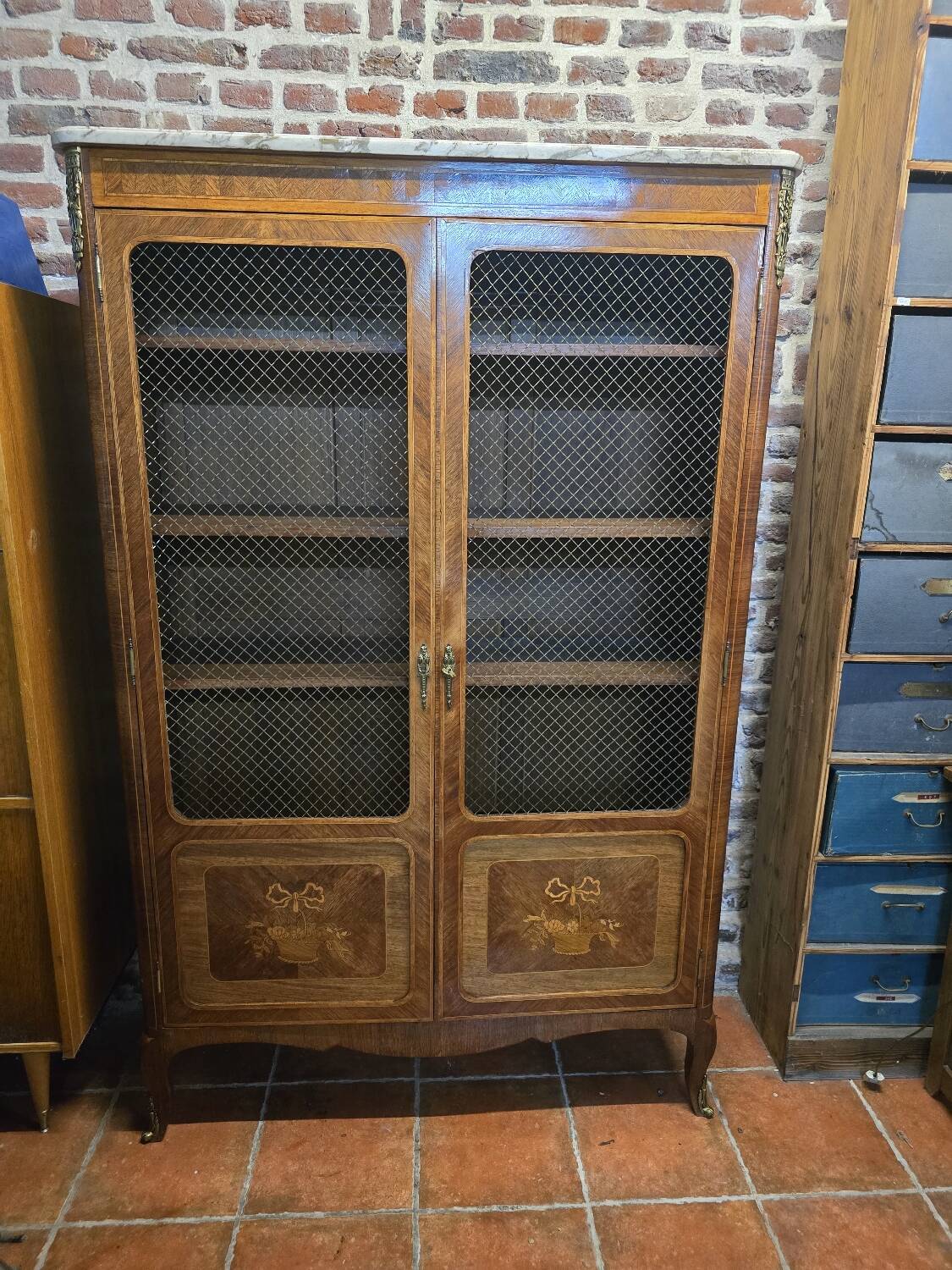 Marquetry bookcase with marble top