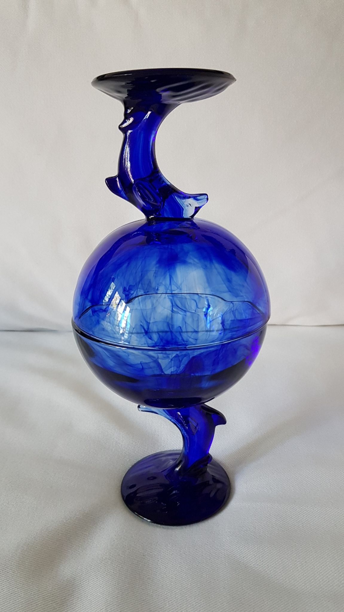 Set of 2 dolphin dessert cups in blue glass.