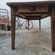 Large antique farmhouse table with a drawer