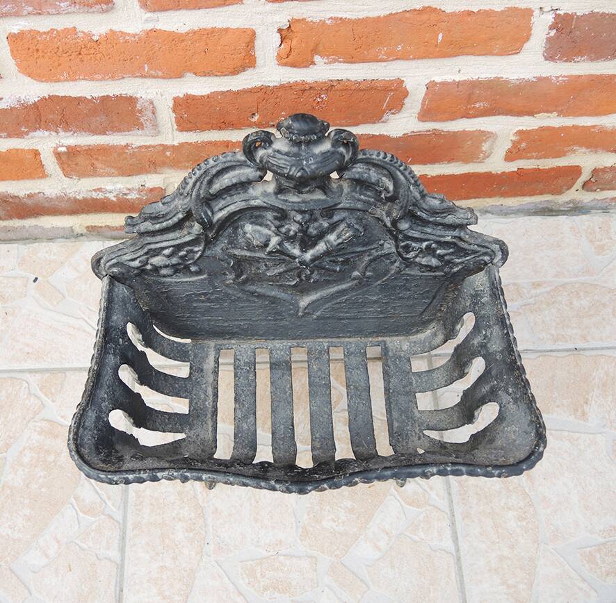 Antique black cast iron log cradle in rococo style