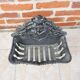 Antique black cast iron log cradle in rococo style