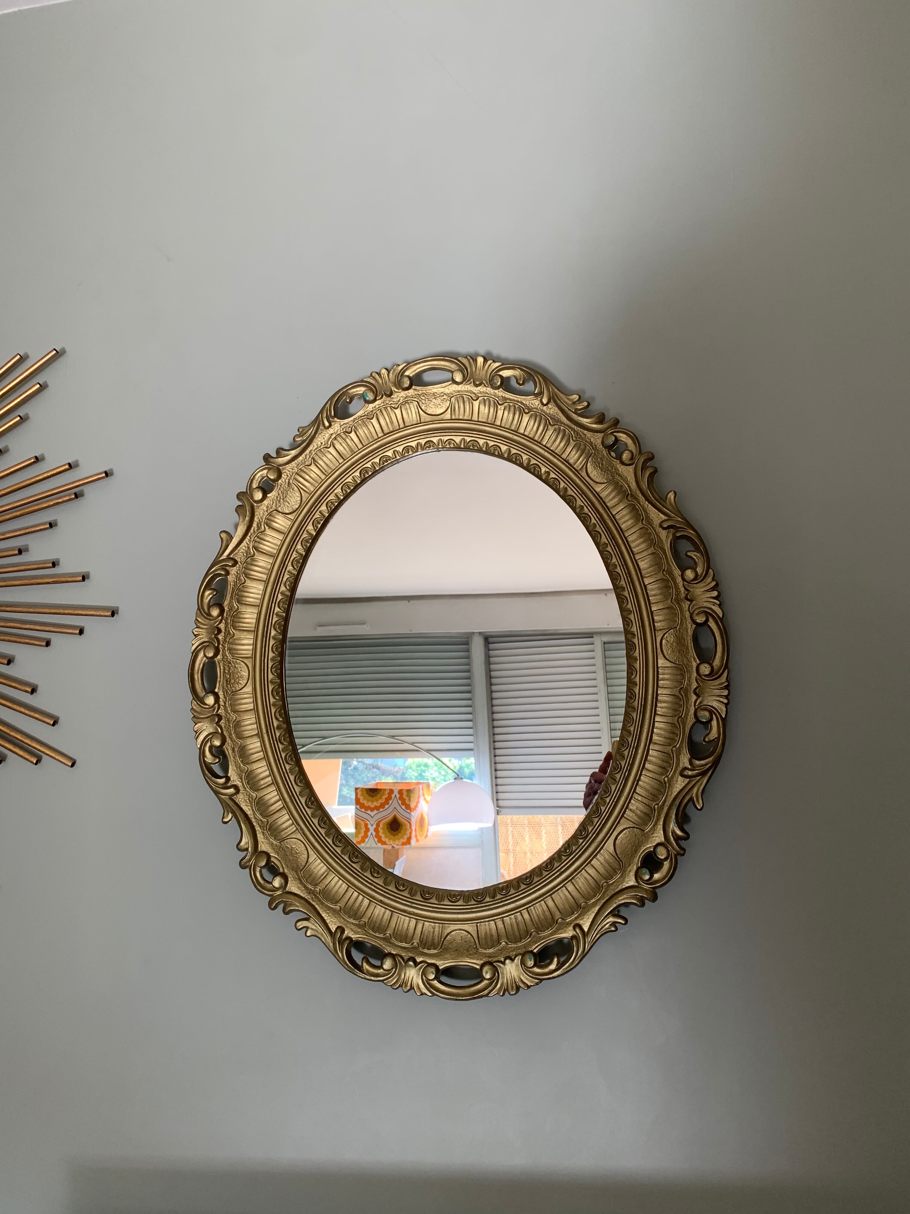 Miroir ovale doré années 70