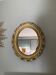 Miroir ovale doré années 70