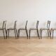 Set of 8 vintage industrial style chairs in metal and wood.
