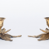 Two candlesticks in holly leaves