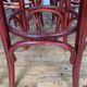 Series of 9 bistro bar stools in curved wooden restaurant sitting red fabric