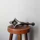 Vintage bronze candlestick chandelier in contemporary Scandinavian design.