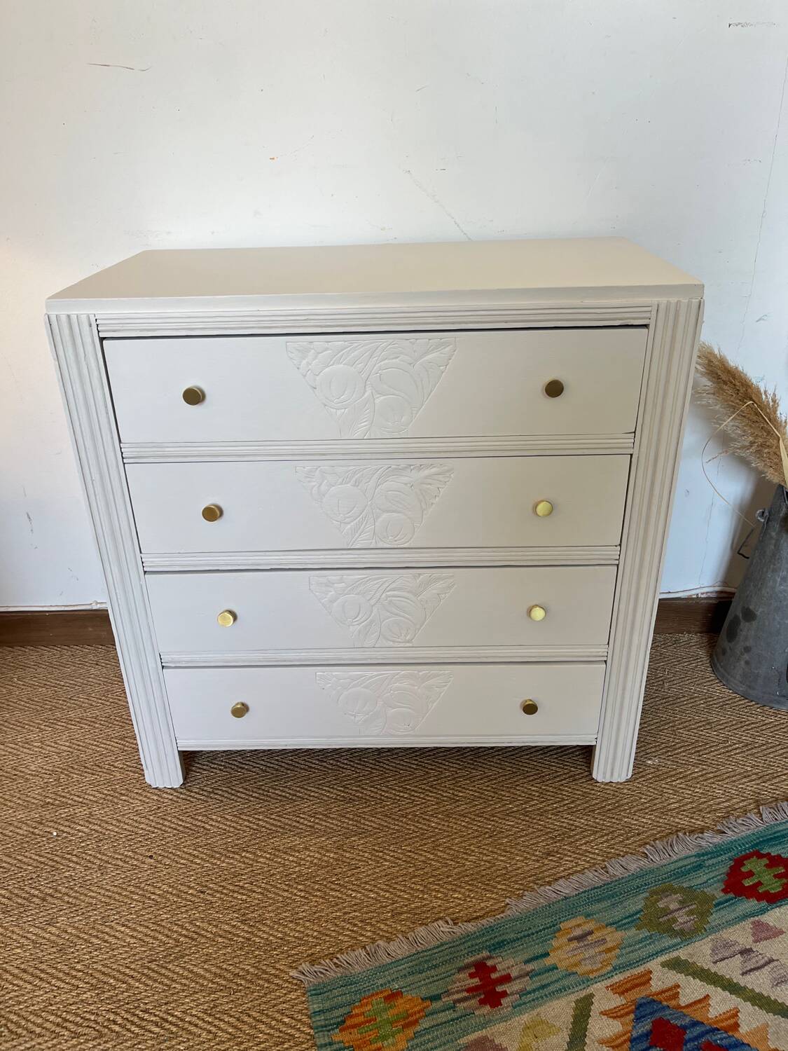 Restored wooden art deco chest of drawers with gilded handles