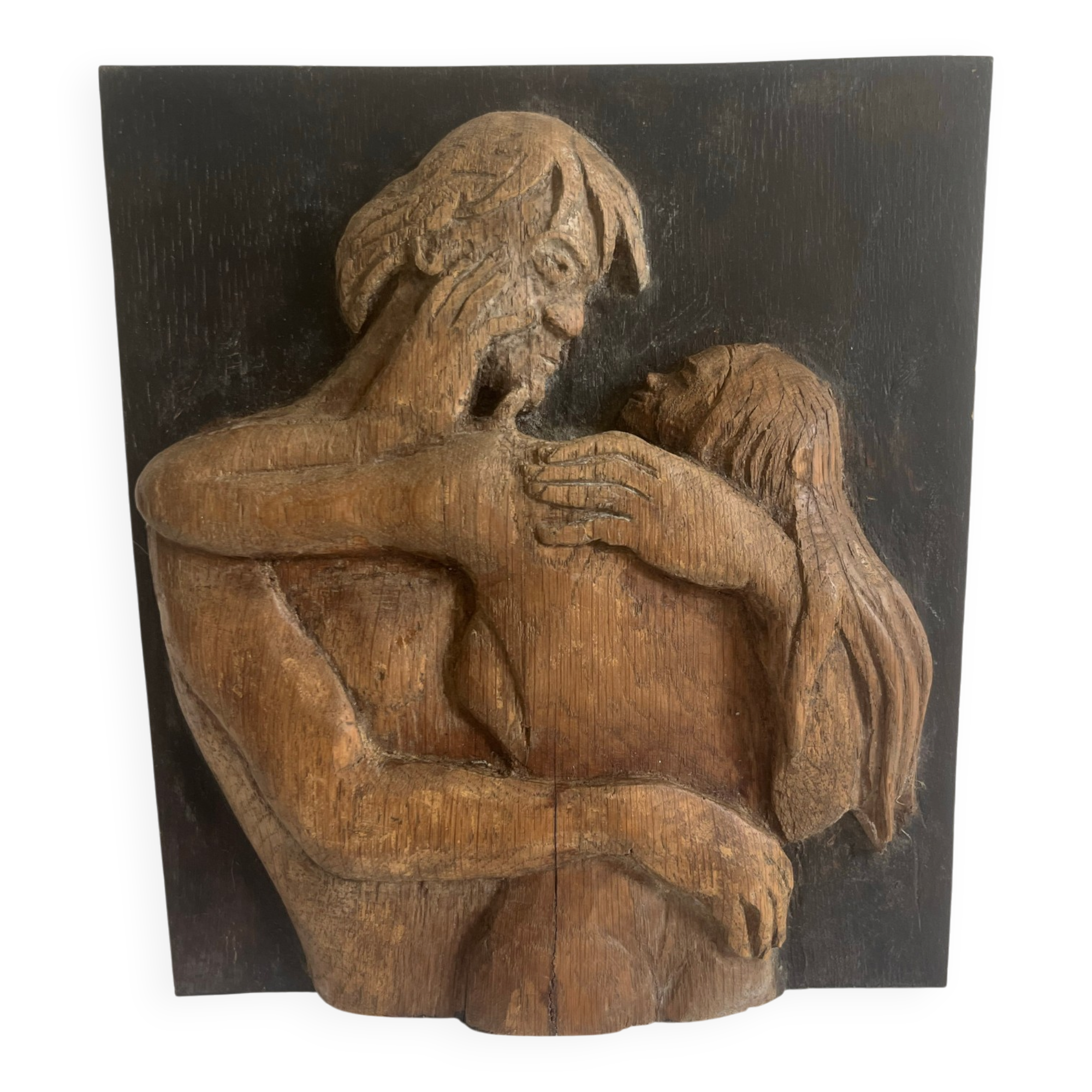 Wood sculpture bas-relief of man, woman, and child, signed.