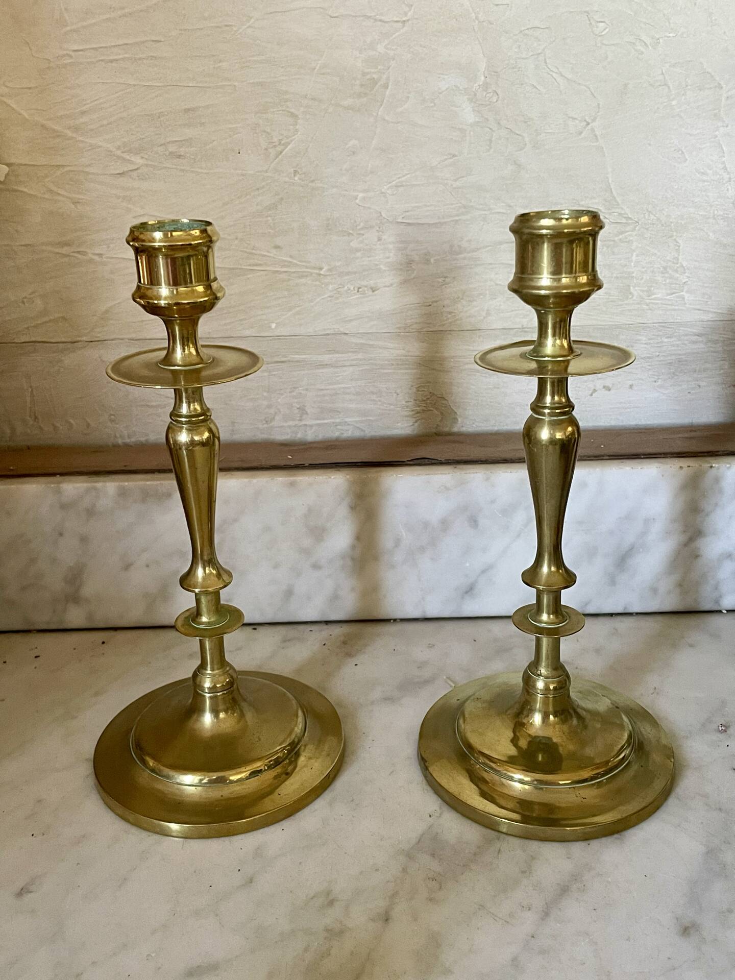 Old pair of turned brass candlesticks