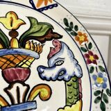 Decorative ceramic plate with griffins