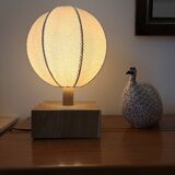 Handmade wooden ball lamp on a stand