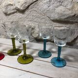 Antique and rare! Sold in a set of 12 colorful twisted stemmed glasses engraved with flowers and leaves