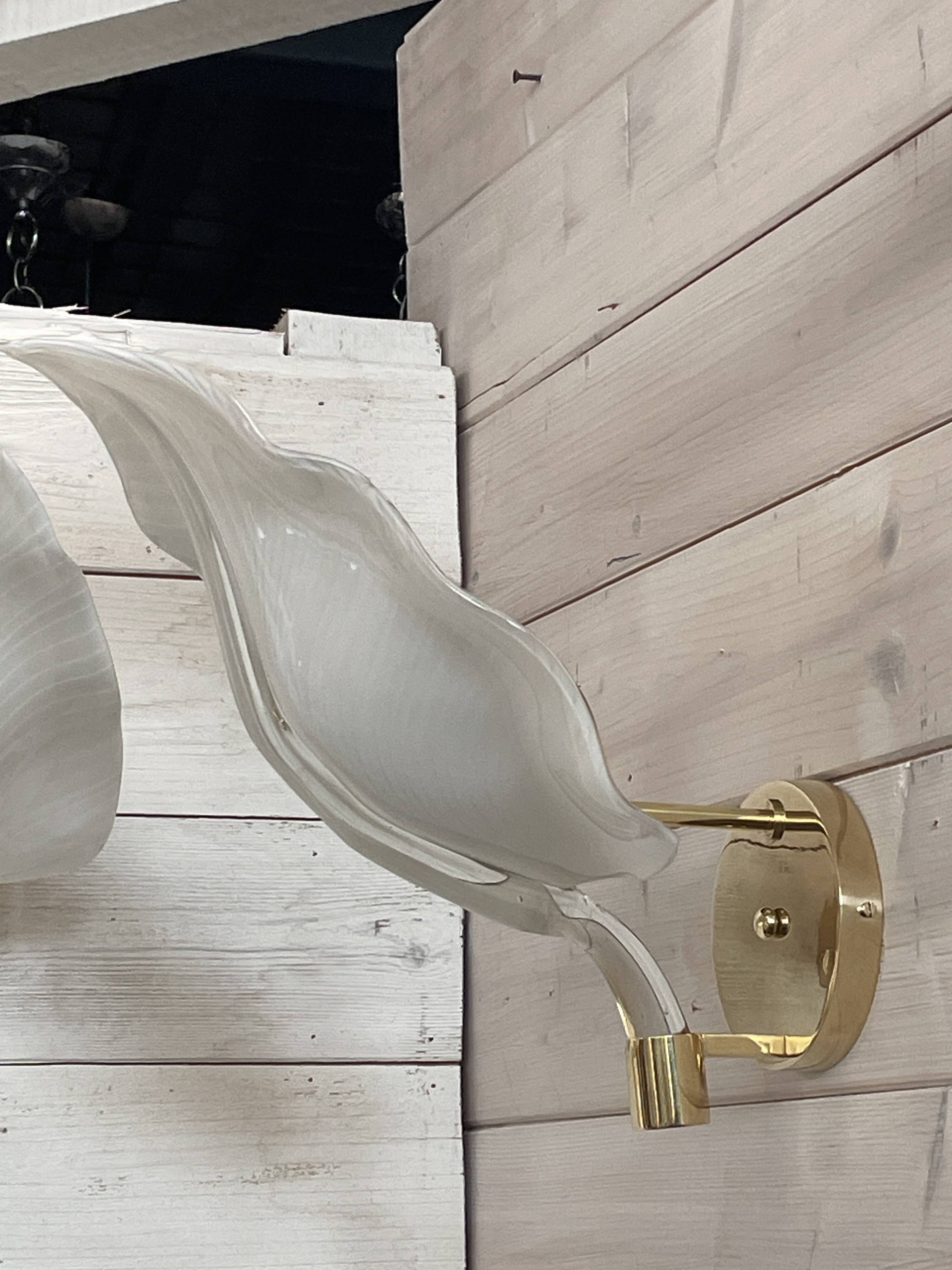 Set of 3 Murano glass wall lamps in white and brass, 1970s.