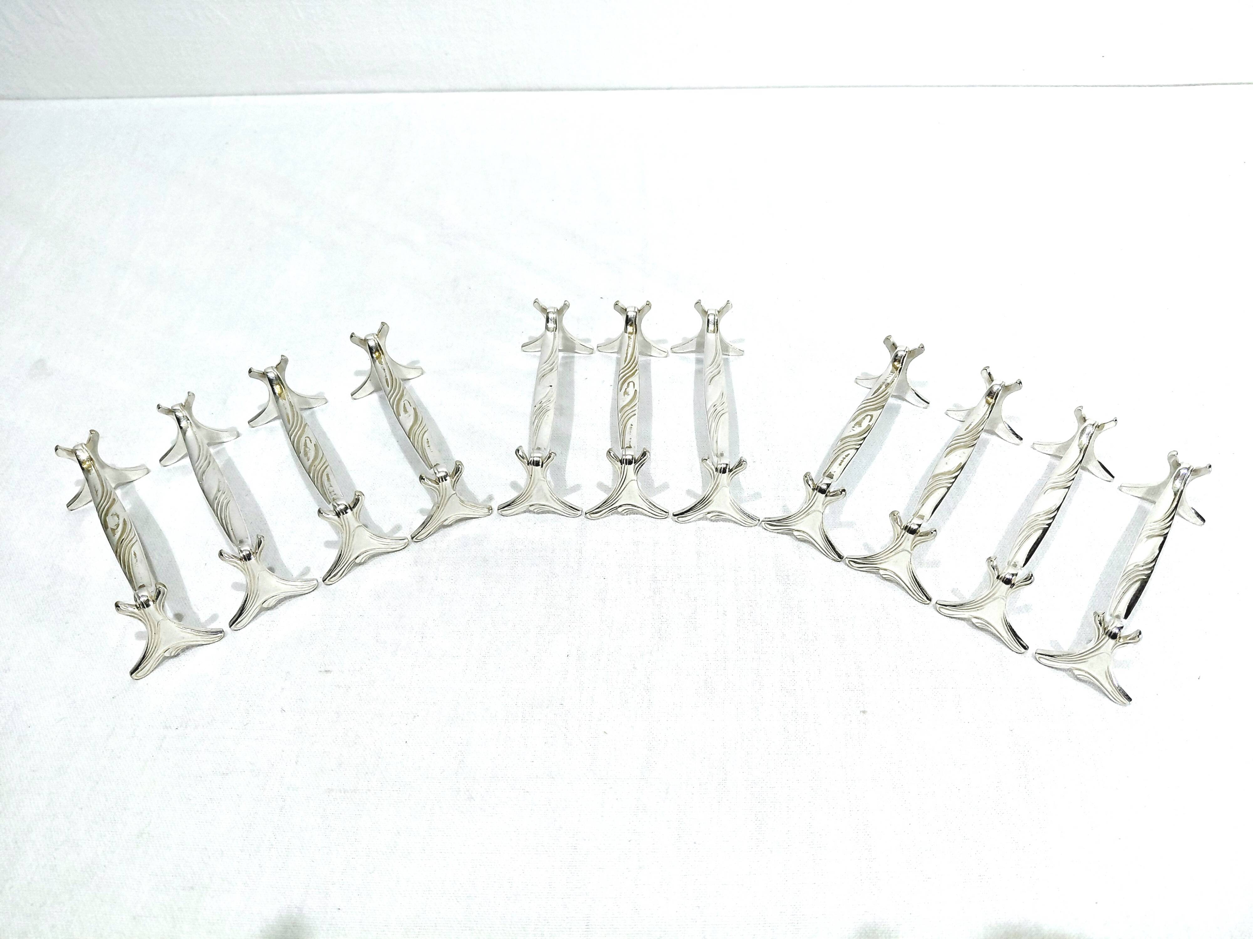 CHRISTOFLE - SET OF 11 SILVER-PLATED KNIFE RESTS