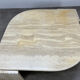 Table basse travertin forme œil par Roche Bobois