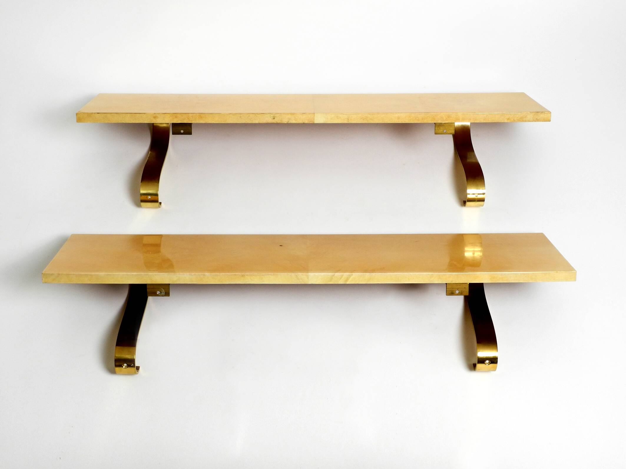 Two 1960s large Aldo Tura shelves made of wood and goatskin in beige