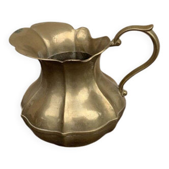 Vintage brass pitcher with "petal" patterns — decorative S-shaped handle, 1950s.