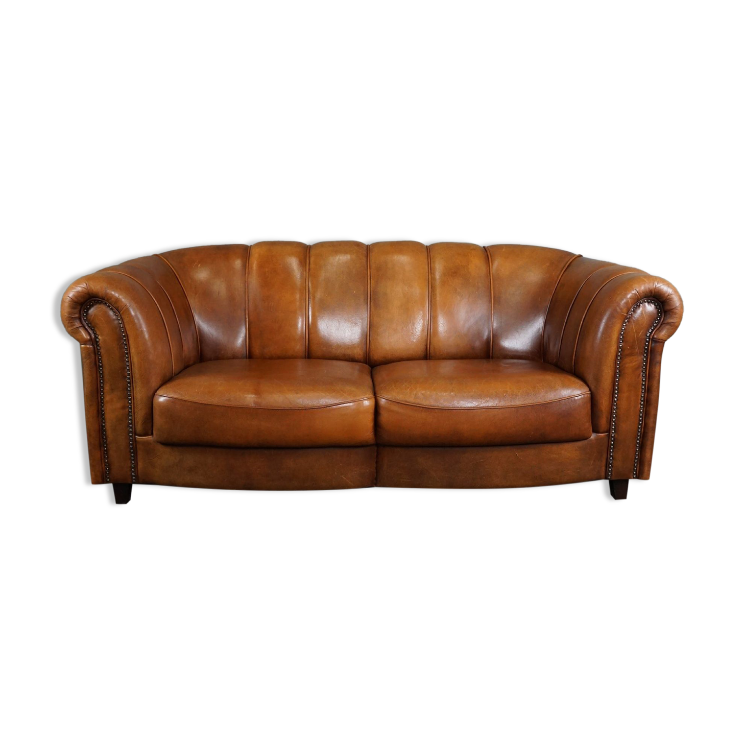 Sheepskin sofa with decorative nails