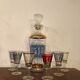 Liquor carafe and 6 assorted glasses